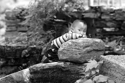 Kid on a rock.