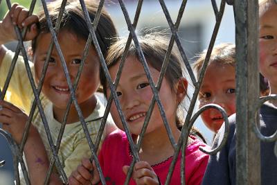 Schoolyard kids. Gao Shan, a high mountain village, Hunan Province, China.