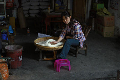 Pink stool. . . Cleaning rice.