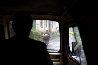 After you get off the bus you start up the hill in a three wheeled motorcycle taxi.