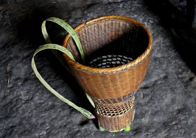Utility basket made of bamboo for carrying anything that will fit.