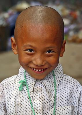 Boy at recycling center. Jishou City, China.