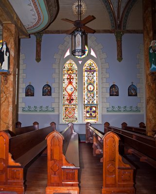 A view of the pews and windows