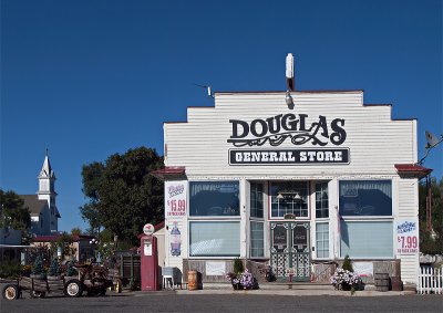 A second view of the Douglas store with a church in the background.