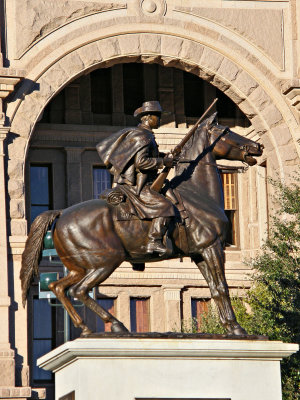 Terry's Texas Rangers framed in the entrance arch to the capitol.
