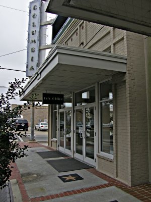 A view of the Box Office Portion of the theater and sign.