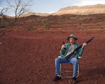 The armed photographer
