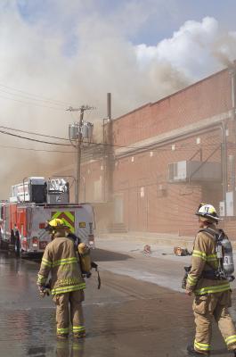 Batalion Chief Helping Hook and Ladder Truck Determine Where to Attack the Fire