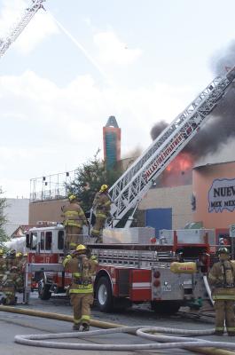 Flames Erupting from the Roof of the Shop Next to the Arcadia