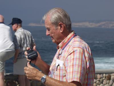 Andy Barada adjusts his trusty Nikon at Seal Beach in La Jolla as George Phillips takes in the view
