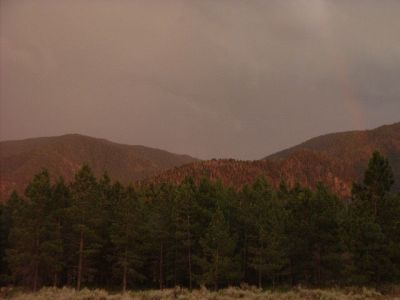 Haze from rainclouds with rainbow on right