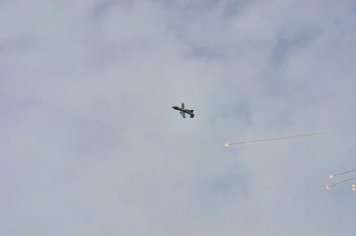 Plane flying over camp