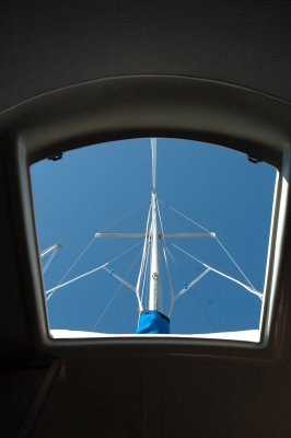 lying in bed, looking out the hatch at the mast