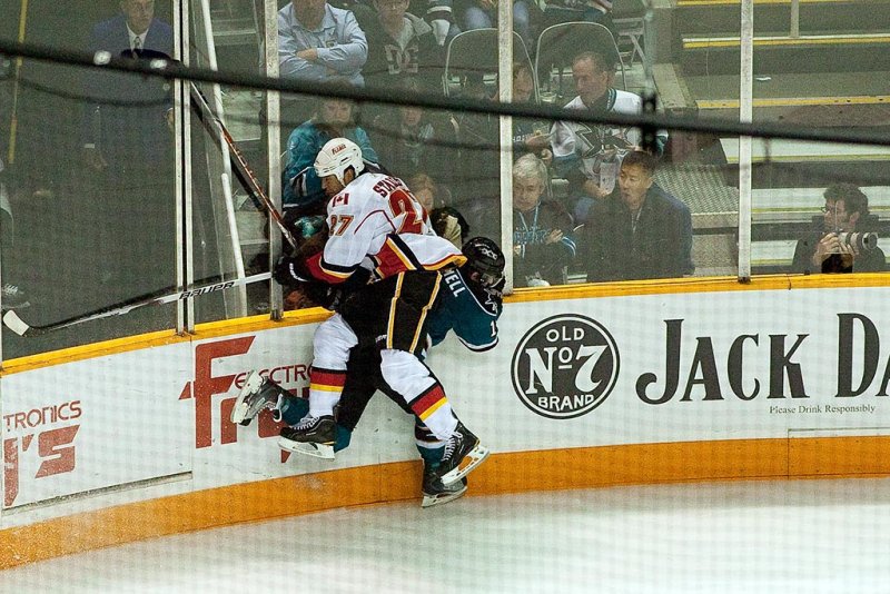 Steve Staios checks Torrey Mitchell