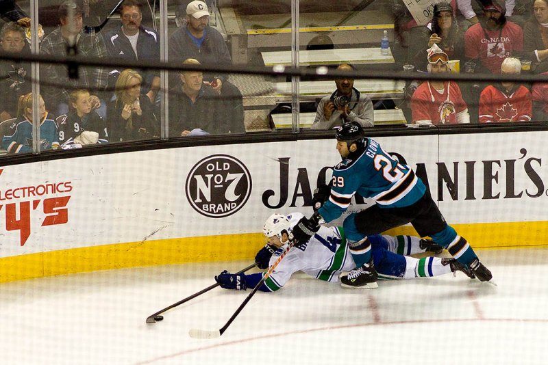 BH2D7545.jpg Keith Ballard keeping the puck away from Ryane Clowe