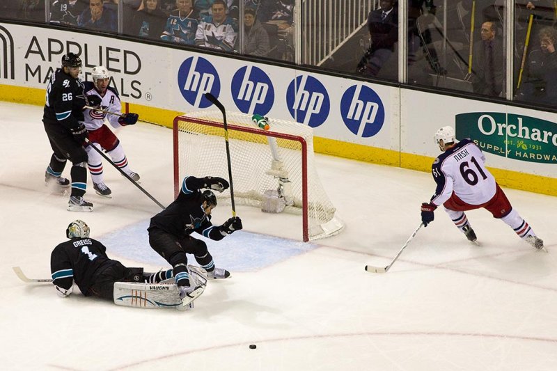 Thomas Greiss trips Dan Boyle