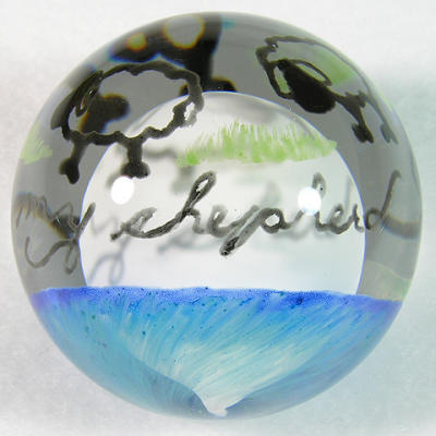 1 3/4, design painted on with glass paint, then encased in clear