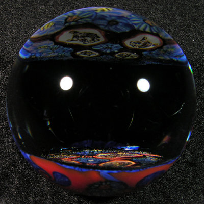 Chris began fusing and then faceting his full murrine disc, and then created the marble around it.