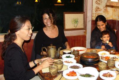 All smiles- Gowri & Sobha enjoying a Korean tradition dinner with Caecil & Adriana