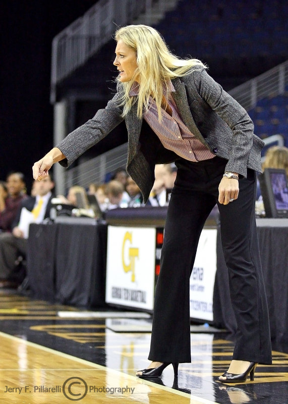 North Carolina State Head Coach Kellie Harper directs her players during play