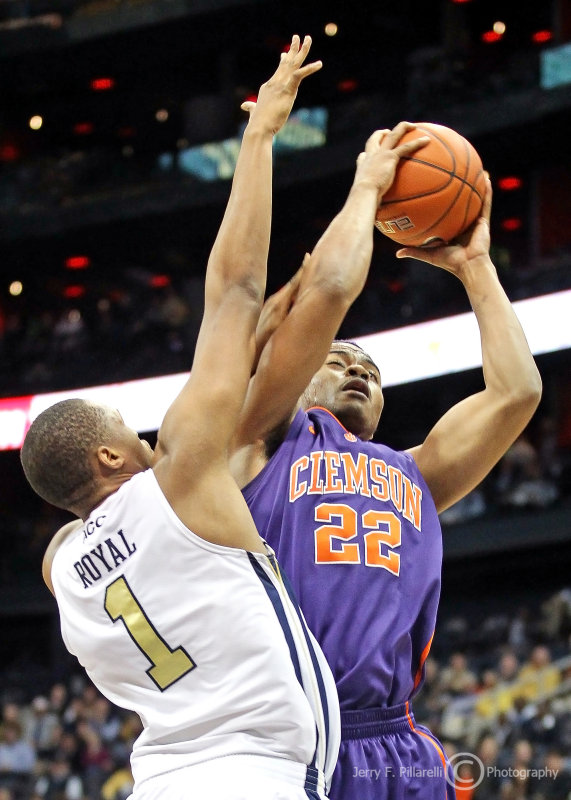 Yellow Jackets F Julian Royal goes up strong trying to block the shot of Tigers F Bernard Sullivan