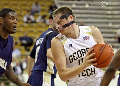 Georgia Tech C Nate Hicks looks for an opening in the defense