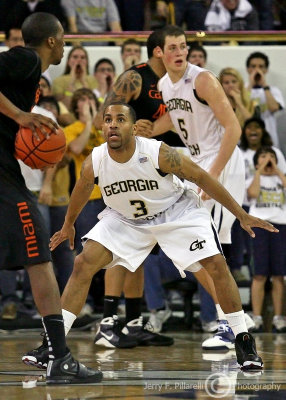 Jackets G Miller squares up on a Hurricanes ball handler