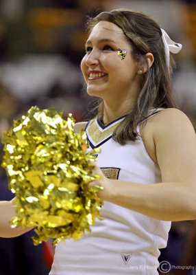 Jackets Cheerleader works the crowd during a break in the action