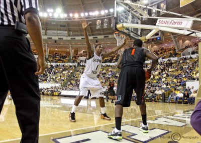 Tech G Shumpert defends the inbound pass from Miami G Durand Scott