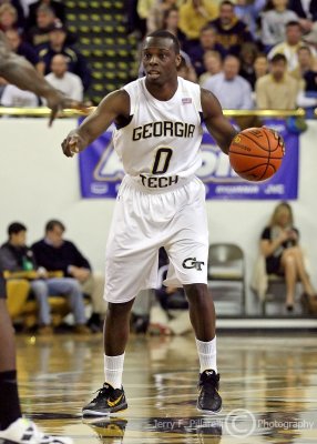 Georgia Tech G Udofia positions a teammate as he brings the ball up court