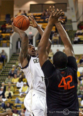 Tech G Shumpert shoots a jump shot over Canes C Johnson