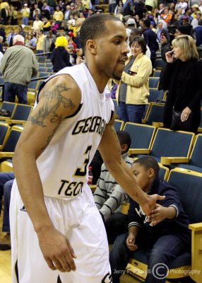 Yellow Jackets Senior G Moe Miller takes a last victory lap around the old Alexander Memorial Coliseum