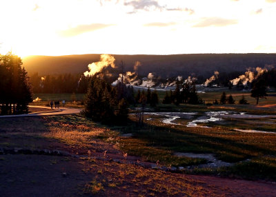 The sun sets over the Old Faithful area in Yellowstone National Park
