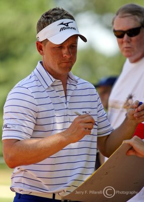 Luke Donald signs autographs at the 93rd PGA Championship