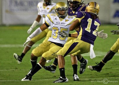 Jackets CB Michael Peterson moves in to tackle Catamounts WR Gary Green