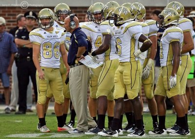 Georgia Tech Defensive Secondary Coach Charles Kelly huddles with his squad