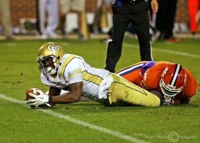Jackets B-back David Sims dives into the end zone for a third quarter score