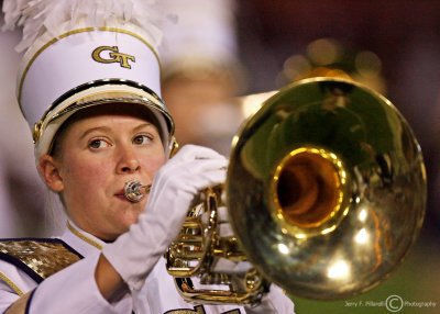 Tech band member plays during the halftime festivities