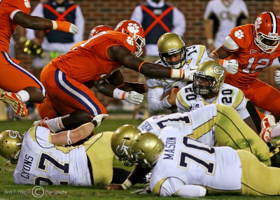 Tech QB Washington dives over the pack towards the end zone