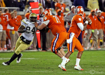 Jackets DE Izzan Cross fights off a block by Tigers OT Phillip Price