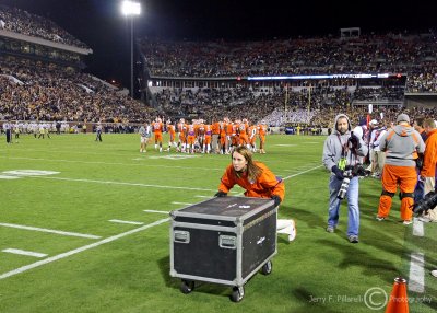 Clemson staff hauls off equipment in anticipation of the fans rushing the field