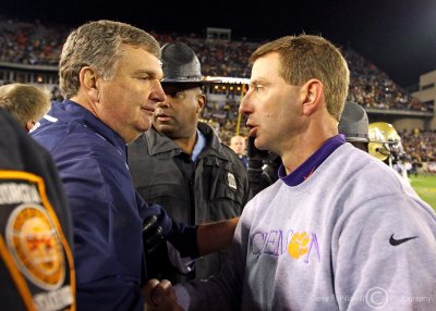 Georgia Tech Head Coach Paul Johnson accepts congratulations from Clemson Head Coach Dabo Swinney