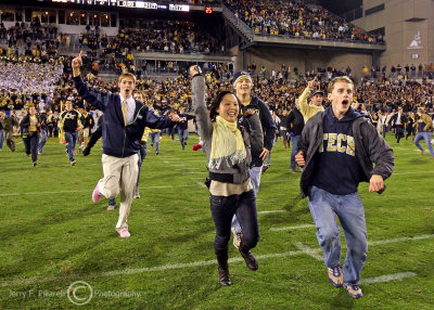 Jackets fans rush the field to celebrate the upset victory