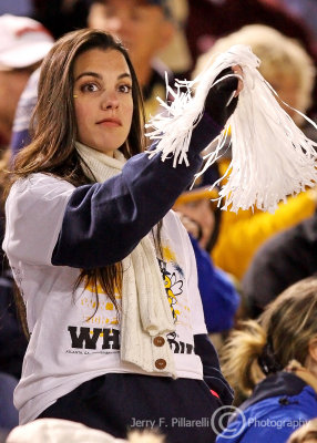 Jackets fan waves her pom-pom for the team