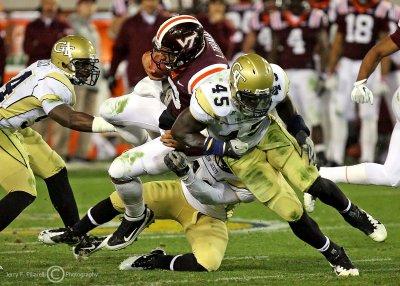 Jackets LB Attachu assists in bringing down Hokies QB Thomas in the secondary