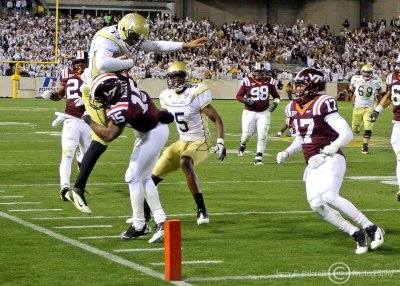 Georgia Tech QB Washington leaps but is stopped short of the goal line by Virginia Tech FS Whitley
