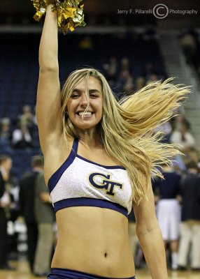 Jackets cheerleader lights up the courtside during a time out