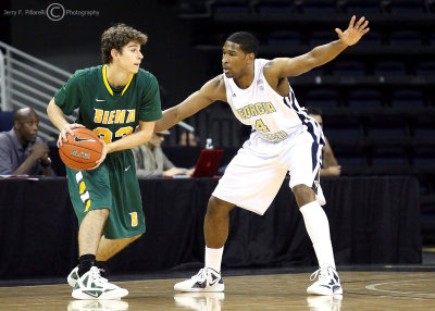 Jackets G Nick Forman guards Saints G Rob Poole out past the arc