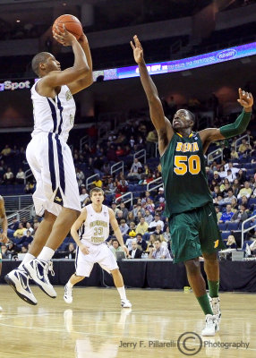 Yellow Jackets F Julian Royal takes the jumper over Saints F OD Anosike