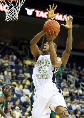 Jackets F Hosley moves around a Saints defender on his way to the basket